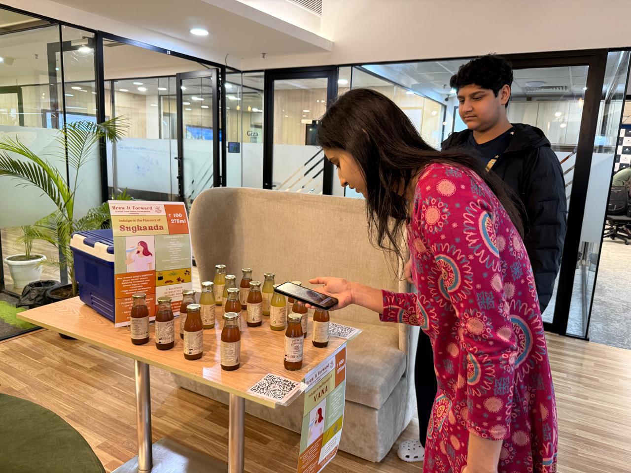 A visitor looking at the bottles at a community tasting